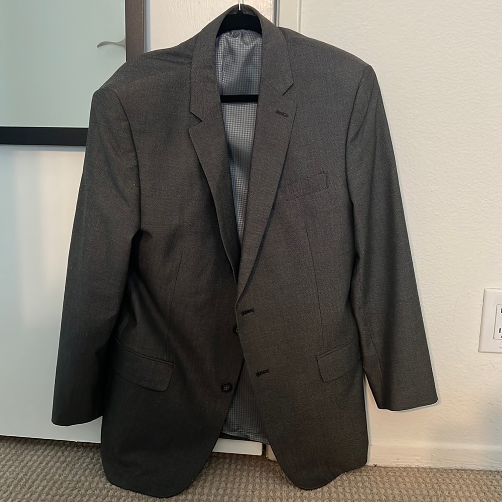 Grey fitted suit. Andrew Fezza brand. Jacket and pants included.